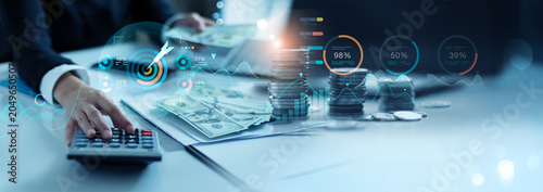 Business Woman using calculator calculate for finance, Online banking and payment, Graph Business growth and  profit, Target, Finance and banking networking, Strategy of financial, Digital marketing.
