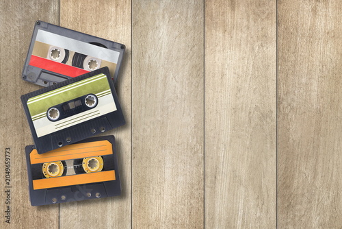 audio cassettes on wooden background