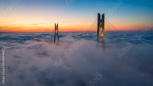 Mega Sea Bridge Emerges from Advection Fog at Sunrise