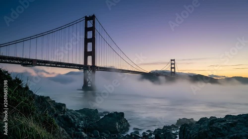 Golden Gate Bridge Emerging from Ocean Fog at Dawn