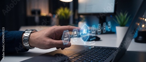 Man's hand interacting with futuristic ai processing workflow interface on laptop screen visualizing data intake cleaning model building output qa and deployment stages in a modern office setting
