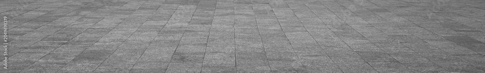 Obraz premium empty stone floor top in perspective. grey tile floor background in perspective view. line. empty copy space stone street. pavement. Granite outdoor tiled floor. gray granite. Marble texture