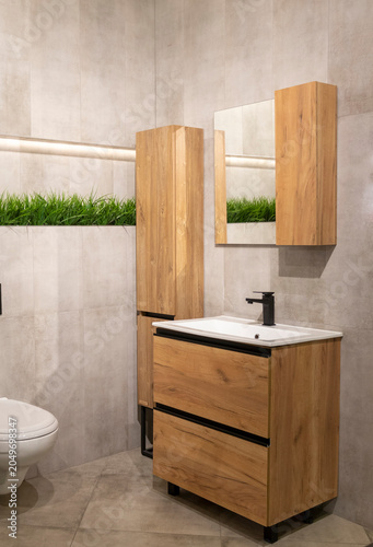 Modern Wooden Bathroom Vanity Unit with Matte Black Faucet and Mirror. Interior