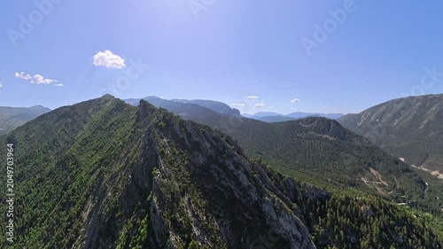 scenic  aerial footage pilot POV of french alps in Provence under blue sly and nice white clouds 