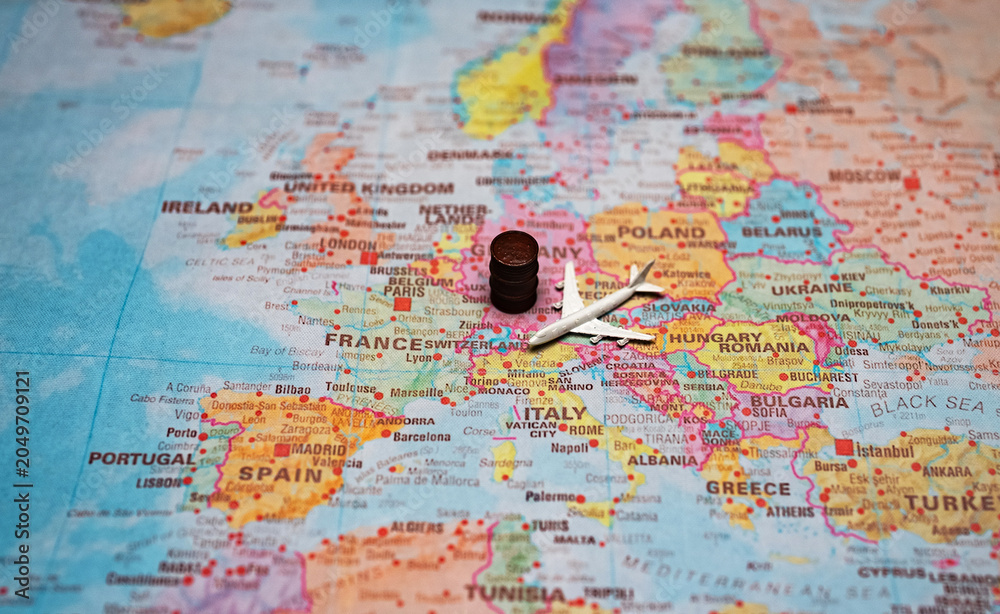 Naklejka premium Airplane and fuel barrel on a map of Europe.