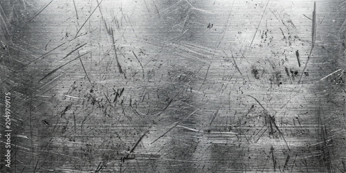 фотографія Distressed brushed metal surface with scratches and texture scratched background