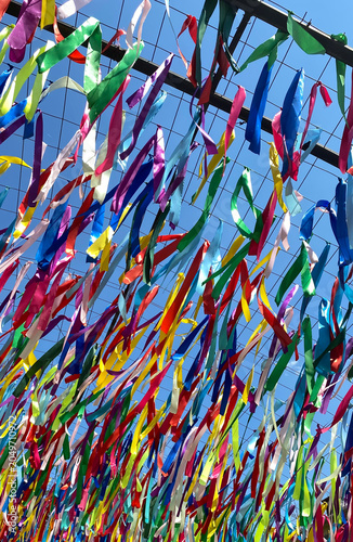 Fényképezés A multitude of colourful ribbons against the blue sky