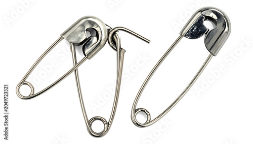 Two silver safety pins linked together, one open showing the clasp, isolated on white