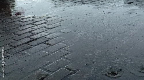 Water ripples on wet paving blocks