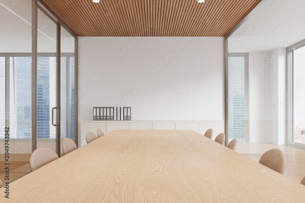 Obraz premium Modern conference room interior featuring long wooden table, elegant seating, glass partitions and urban skyline view in bright minimalist workspace. 3D Rendering