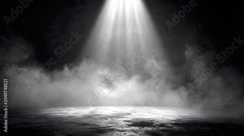Bright white spotlight shining down onto an empty textured concrete floor surrounded by dense smoke and fog in a dark room