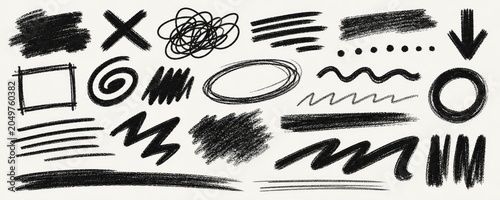 Collection of hand-drawn black scribbles, lines, dots, and shapes on a textured offering versatile graphic design elements.