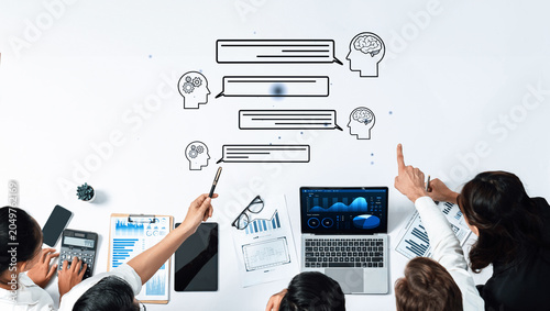 Team Collaboration and Brainstorming Session with Technology and Data Analysis on a White Table Surface. Entropy.