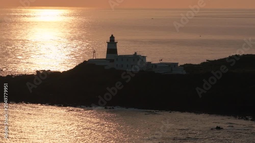 Aerial view of coastal lighthouse on rocky shore in Taiwan 