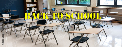 Back to School Written OVer Desks in a High School Classroom