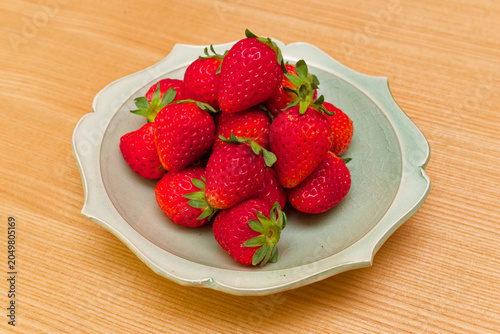Fresh ripe strawberries on a small plate in Japan