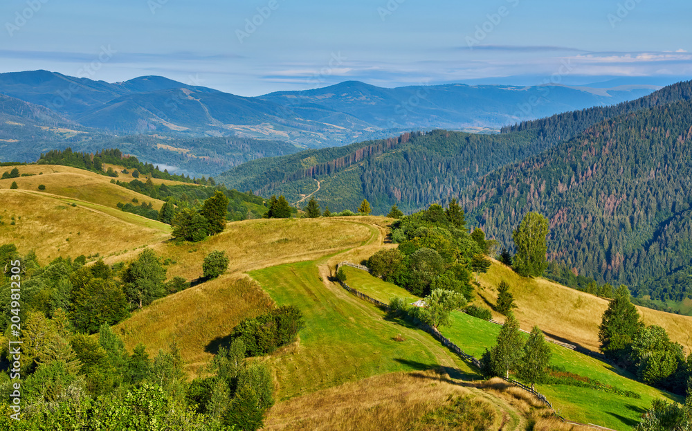 Fototapeta premium Rolling Hills Mountain Village Landscape