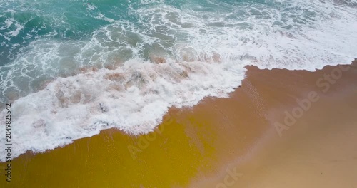 waves breaking on the beach