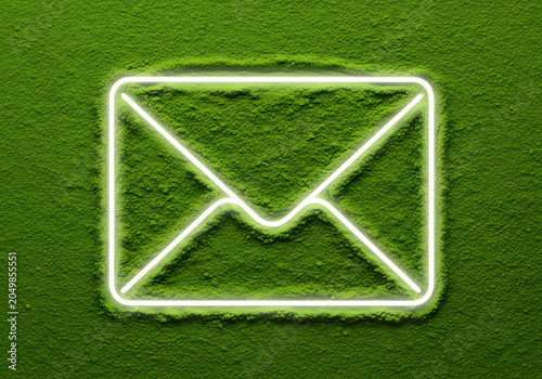 Glowing neon envelope icon on a vibrant green matcha powder background