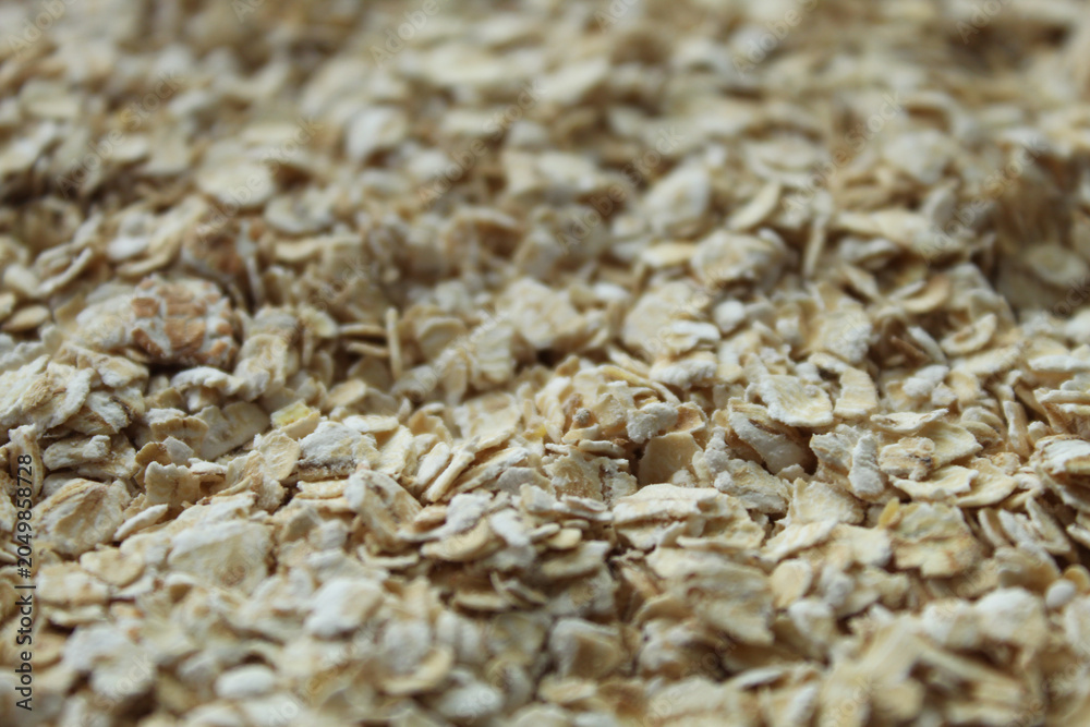 Obraz premium Oatmeal flakes macro texture top view