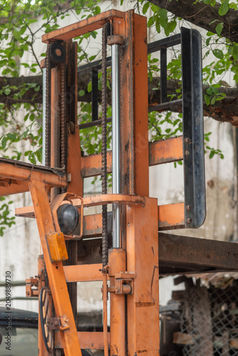 An old forklift was parked and abandoned.
