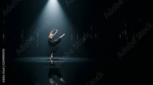 Solitary Contemporary Dancer Under Single Spotlight