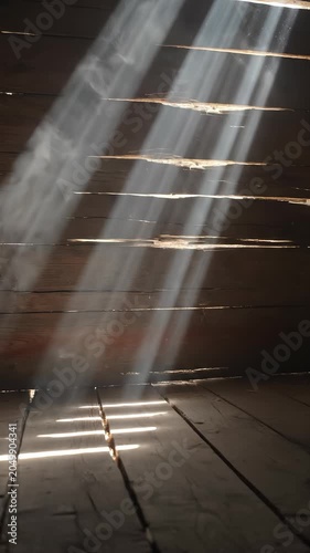 Bright Sun Rays Shining Through Wooden Barn Wall Planks
