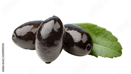 Fotografía Three glossy black olives with a green leaf, isolated on transparent background