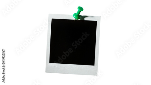 Obraz na płótnie Blank white instant photo frame pinned with green pushpin, isolated on transpare
