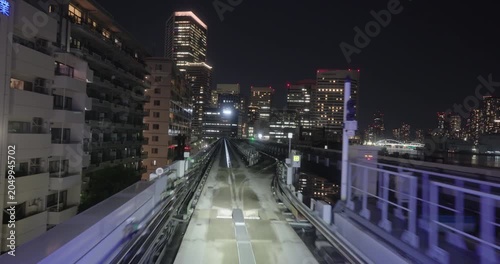 Train goes through city at night,  concept of speed