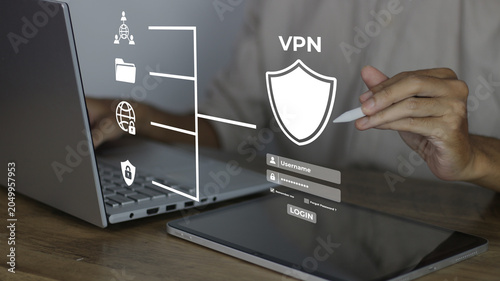 фотографія Businessman connecting to a secure VPN on a laptop and tablet for data protection