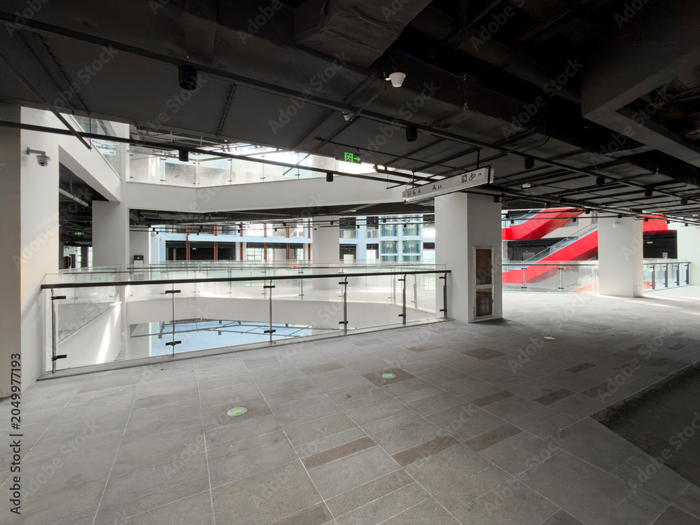 Obraz premium Modern Architectural Interior with Open Space and Dynamic Design Elements