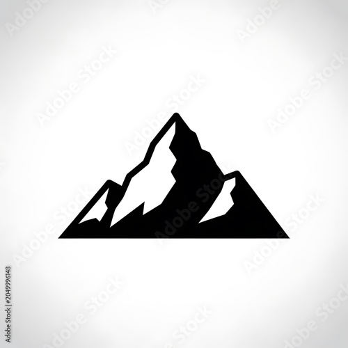 Black silhouette of a mountain against sky.