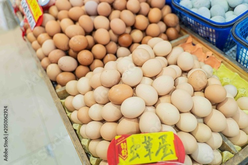 Local chicken eggs in the shop. near The Tree Building, Shanghai, China on a Sunny Spring Day Travel Lifestyle Photo Posing Outdoors.