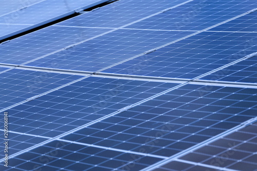 Obraz na płótnie Angled View of Monocrystalline Solar Panels with Mounting Rails