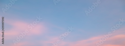 Vivid depiction of a serene morning sky with a captivating blend of orange an...