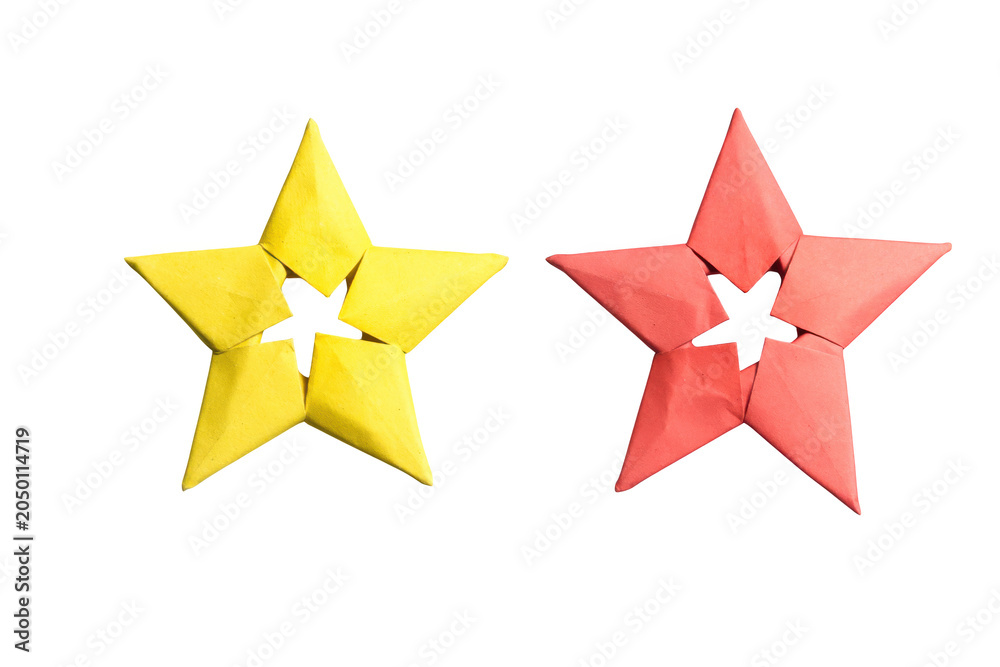 Fototapeta premium Yellow and red origami stars arranged together isolated on transparent background simple festive craft objects.