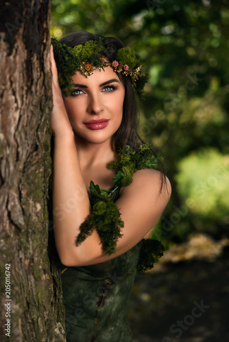 Forest fairy covered in moss