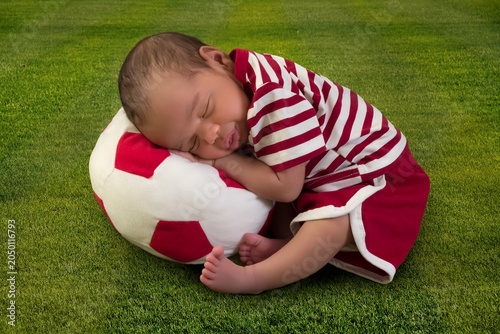 African newborn baby in soccer costume