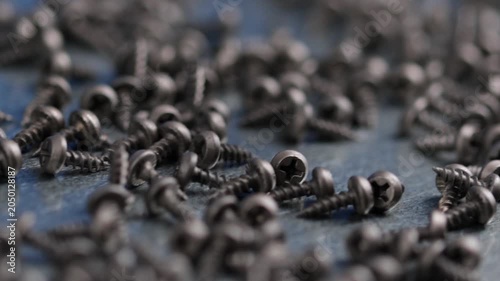 Metal screws for fastening equipment. Soft focus. Close-up. 