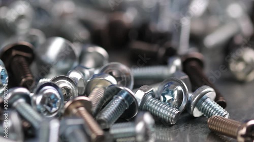 Metal screws for fastening equipment. Soft focus. Close-up. 