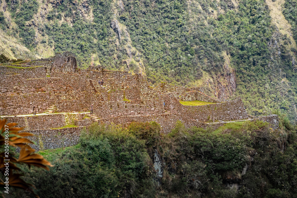 Obraz premium Ancient stone ruins on mountain hillside Andes, Peru - April 30, 2019 LHO Rami
