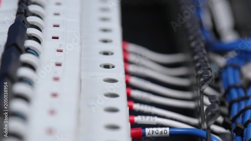 Marking electrical wiring wires with thermally printed nylon tape. 