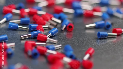 Metal tips with a plastic base for copper electrical wires. 