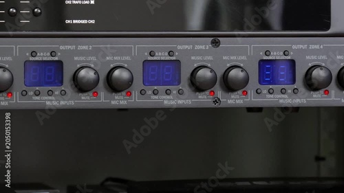 Front control panel of the audio amplifier with level controls and display. 