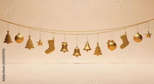 Canvastavla Golden Christmas ornaments and decorations hang on a string isolated on a soft peach background, festive holiday season