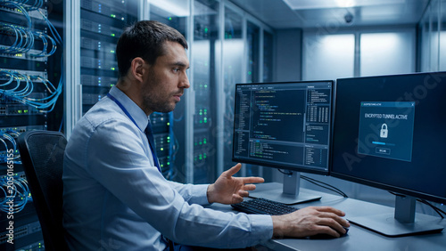 Cybersecurity analyst monitoring multiple screens in a modern data center server room