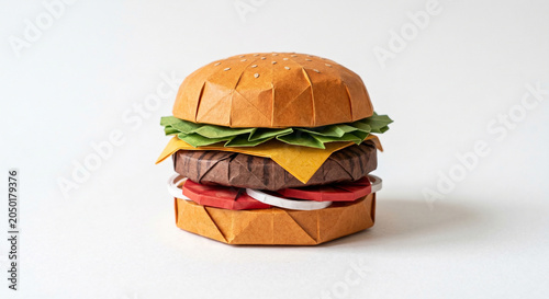 Origami hamburger with lettuce cheese tomato and onion isolated on white background