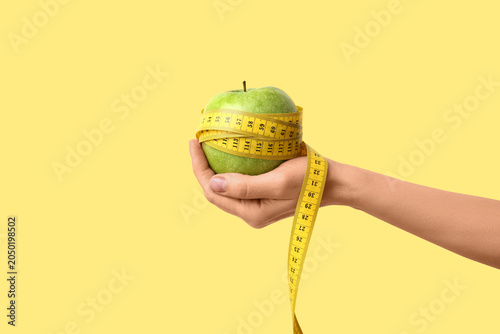 Female hand with fresh appl...