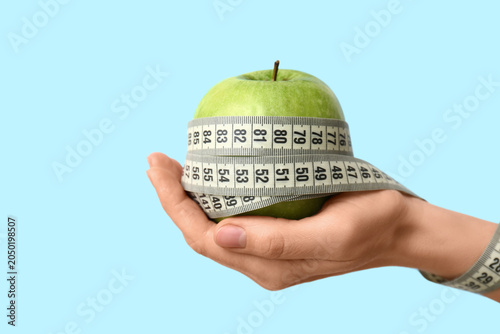 Female hand with fresh appl...